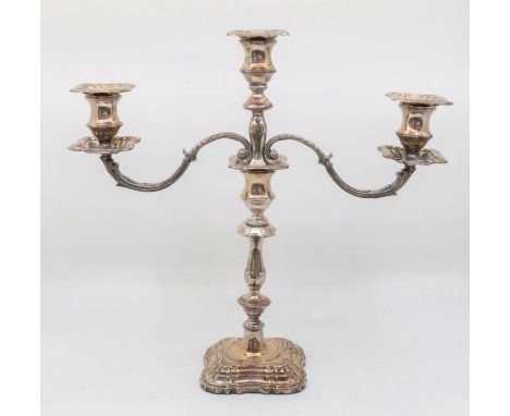 A Modern silver three light candelabra, detachable drip pans and branch, with spool shaped sconce above knopped body on shape