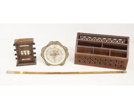 A collectors lot to include; hardwood Indian desk tidy, 1930's desk calendar with 1950's clock and army swagger stick