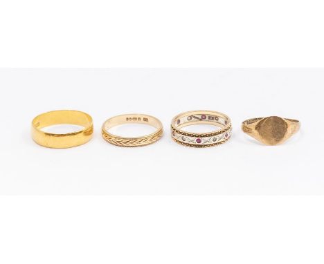 Four gold rings including a 22ct gold band, size N, weight approx  3.2gms along with a 9ct gold machine engraved band, size K