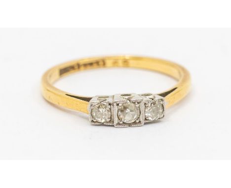 A 1930's diamond and 18ct gold three stone ring, comprising square platinum settings set with three graduated small old cut d