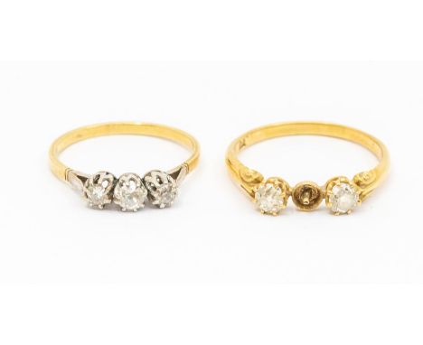 Two diamond set 18ct gold rings, including a three stone ring, platinum set with three old cut diamonds, (nibbles and chips t