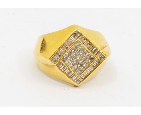 A gents diamond and 18ct gold dress ring, angled shoulders to a diamond shaped top set centrally with pave set princess cut d