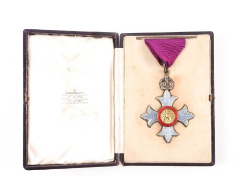 A cased C.B.E. A Commander of the British Empire neck badge, (1st type). The obverse bearing Britannia seated the reverse an 