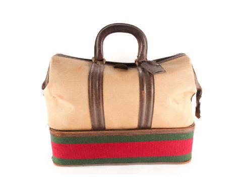 A Vintage Gucci of Italy tan canvas and leather holdall/ weekend bag zipped bottom section with a red and green band bearing 