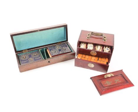 A 19th-century parquetry cribbage box containing a bezique set (incomplete). The box inlaid with a Tumbling Cube" design in t
