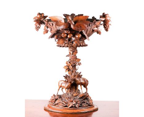 A large exhibition quality Black Forest centrepiece, circa 1900, the woven effect bowl with fruiting vines, oak apples and le