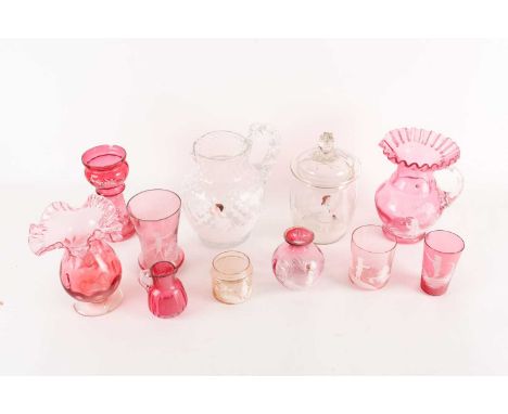 A collection of Mary Gregory glassware, 19th/20th century, comprising jugs, beakers and vases, decorated in white enamel with