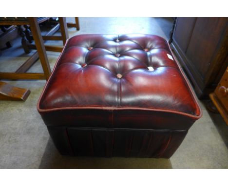 A red leather pouffe