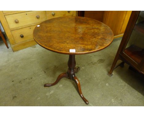 A George III oak circular tripod table