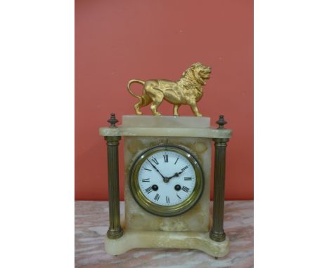 A 19th Century French alabaster and brass mantel clock