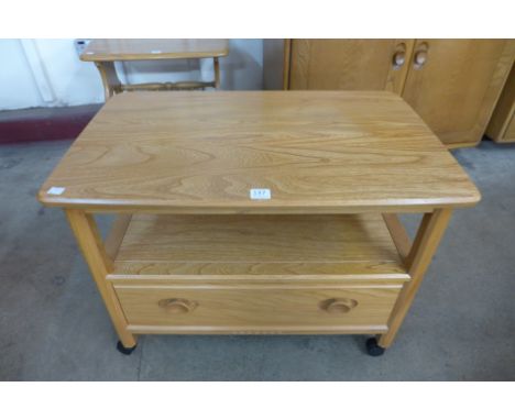 An Ercol drop leaf side table
