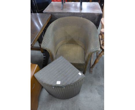 A Lloyd Loom gold wicker chair and linen box