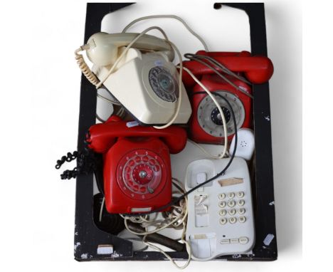 A group of 1970s and '80s rotary retro style landline telephones 
