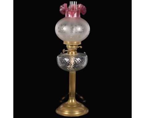 A brass duplex oil lamp, with moulded glass font and etched glass shade, with chimney, H65cm 