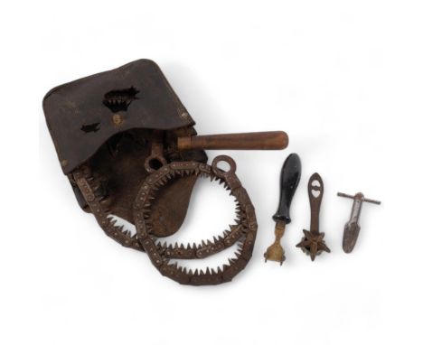 A trench art folding saw in case, a leather pattern tool, a Marvel cigar tool, and a Cinderella pattern cutter 