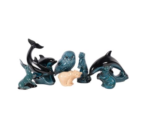 A group of 2 Poole Pottery dolphins, H24cm, Poole owl, seal, otter, etc 