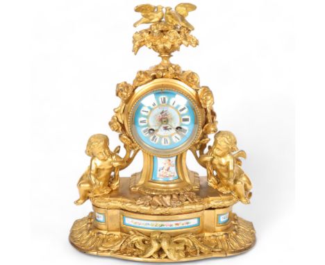 An Antique French ormolu mantel clock, with a blue ceramic dial and black Roman numerals, with pendulum, H36cmGood overall or