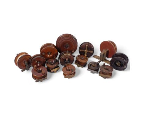A collection of Vintage wooden fishing reels, and a Bakelite Allcock aerialite reel 