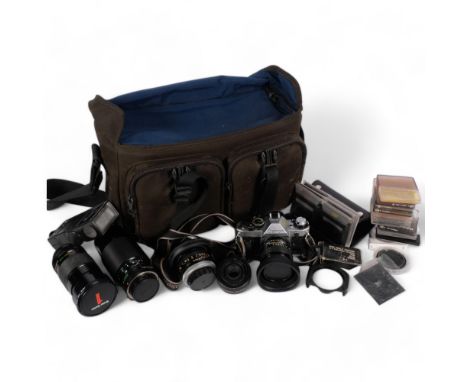 A selection of Vintage cameras and associated equipment, including a Canon AE-1 Programme camera, a Vivitar 28-90mm lens, a 5