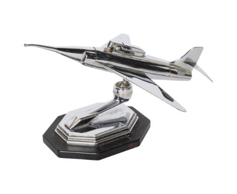 A Vintage chrome plate table lighter in the form of a jet aeroplane on stand 