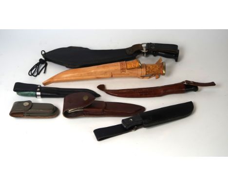 A modern Finish survival knife and companion knife
With straight single edged blade, decorative wooden grips, together with a