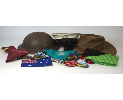 A World War II period army steel helmet
With inner lining and chin strap, a Royal Navy cap with handmade HMS Ajax tally, Aust