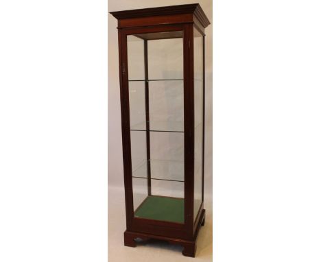 A good quality George III style glazed mahogany pedestal tall display cabinet, 20th Century
The full length lockable door enc