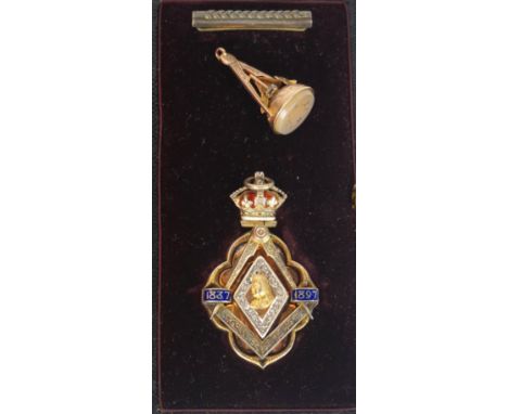A 9ct gold hallmarked Masonic fob
The top decorated with dividers, trowel and further Masonic emblems, a cased silver gilt Qu