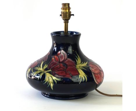 Moorcroft Pottery lamp 
Of baluster form, decorated in the Anemone pattern decorated on a blue ground, impressed factory mark