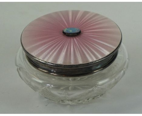 Art Deco cut glass powder compact 
With hallmarked silver and salmon pink guilloche enamel, having central cabochon of an bla