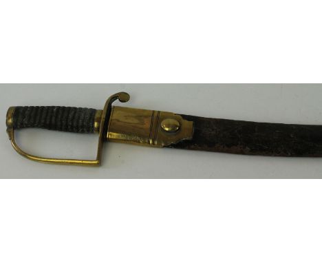 A Victorian police hanger circa 1860
The 61cm curved single edged single fullered blade, with brass guard, fish skin grip, co