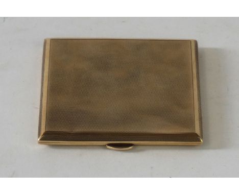 A 1930's 9ct gold cigarette case 
With engine turned decoration, the cover opening to reveal vacant interior with original st