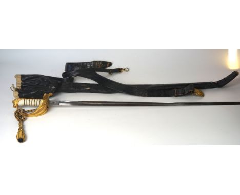 A fine quality George VI Royal Naval Officers sword
The 80cm single edged single fullered blade with acid etched decoration o