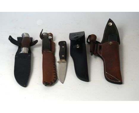 A modern survival knife 
With straight single edged bowie style blade, stamped 'Made in Sheffield', complete with leather sca