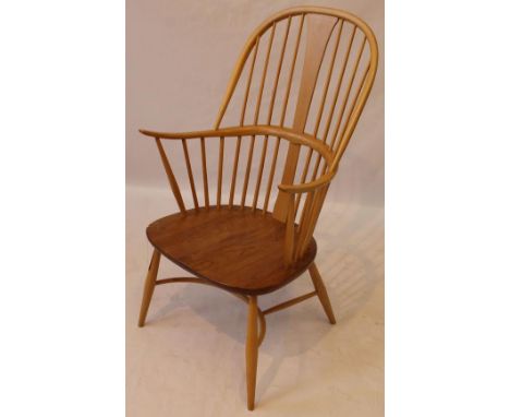 Contemporary Ercol light elm Windsor spindle back armchair 
With crinoline stretcher, height 109cm. 