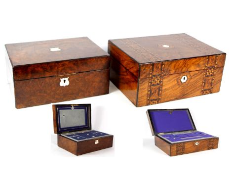 Two 19th Century burr walnut sewing boxes
The first inlaid with satinwood crossbanding and hexagonal cartouche and escutcheon