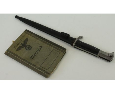 A Weimar period German K98 bayonet
With 20cm single edged single fullered blade, with knurled grips complete with metal scabb