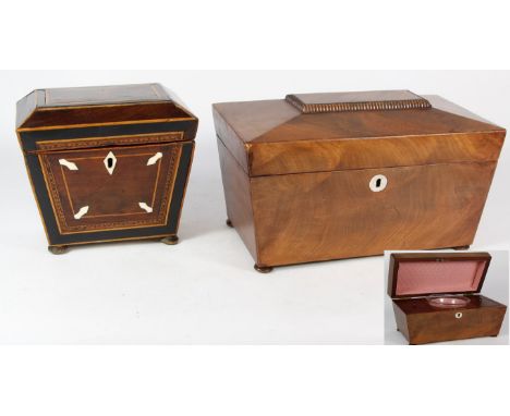A Regency inlaid mahogany and satinwood tea caddy
Of sarcophagus form, raised on compressed bun feet, the faceted top reveali