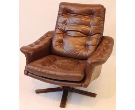 Post-war 1950's style brown leather armchair
Upholstered in a button back, seat cushion brown leather, raised on stained plin