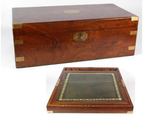 A Victorian mahogany writing box
The rectangular section brass bound box with inlaid heraldic cartouche inscribed 'Presented 