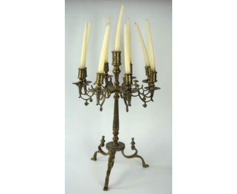 A mid 20th Century incised brass Jewish candelabrum 
Raised on three swept tripod supports, to a tapered and basal knopped st