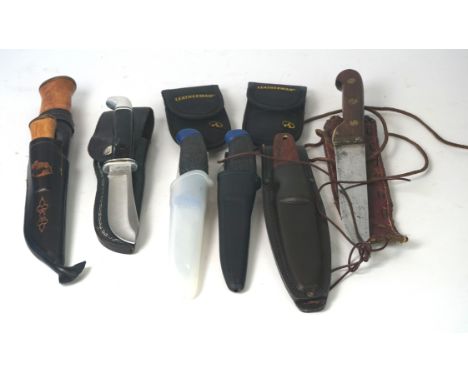 A modern Finish survival knife together with smaller companion knife
With straight single edged blade, complete with leather 