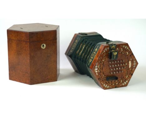 A Boosey & Sons concertina by George Case, circa 1860
The forty eight button walnut cased concertina with pierced fret work a