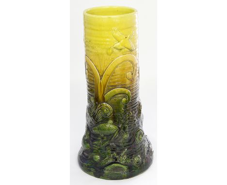 Arts & Crafts Bretby Art pottery cylindrical stick stand 
Relief decorated with birds of paradise and fish on a green and yel