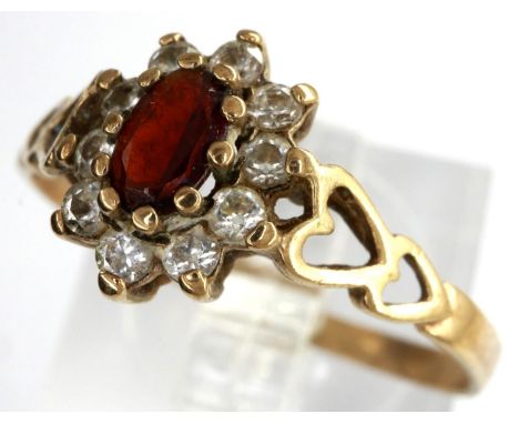 9ct gold cluster ring set with garnet and cubic zirconia with pierced heart shoulders, size O, 1.4g. P&amp;P Group 1 (£14+VAT