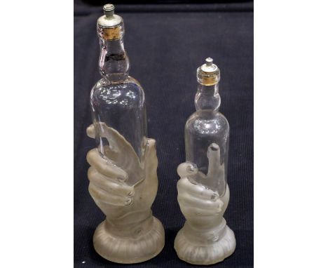 Two 1920s glass French bath bottles, largest H: 32 cm, slight moulding crack to rim of larger bottle otherwise, no chips crac