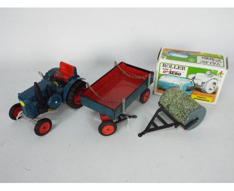 Kovap - A vintage clockwork presses steel tractor and drawbar trailer with chains and opening tailgate, also comes with a box