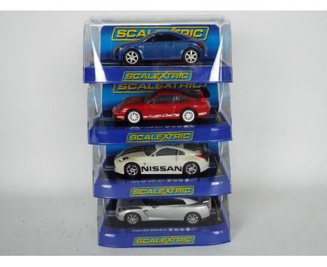 Scalextric - Four boxed Scalextric slot cars all contained within boxes unassociated with the model. Lot consists of an Audi 