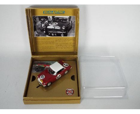 Scalextric - A boxed limited edition 'Old Faithful' MGB 50th Anniversary model. # C3207A. The car appears Mint in a Mint pres