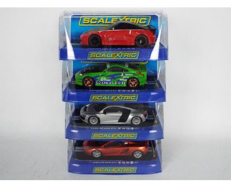 Scalextric - Four boxed Scalextric slot cars all contained within boxes unassociated with the model. Lot consists of a McLare
